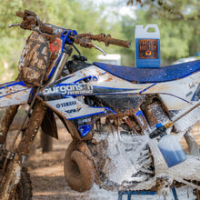 Mud Melter foam cannon dirt bike wash bottle on muddy bike